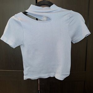 Baby blue nylon crop top with cut out design. Size: one size